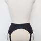 black, retro style, 6 strap Scarlett garter belt with black straps and lace side inserts, back view
