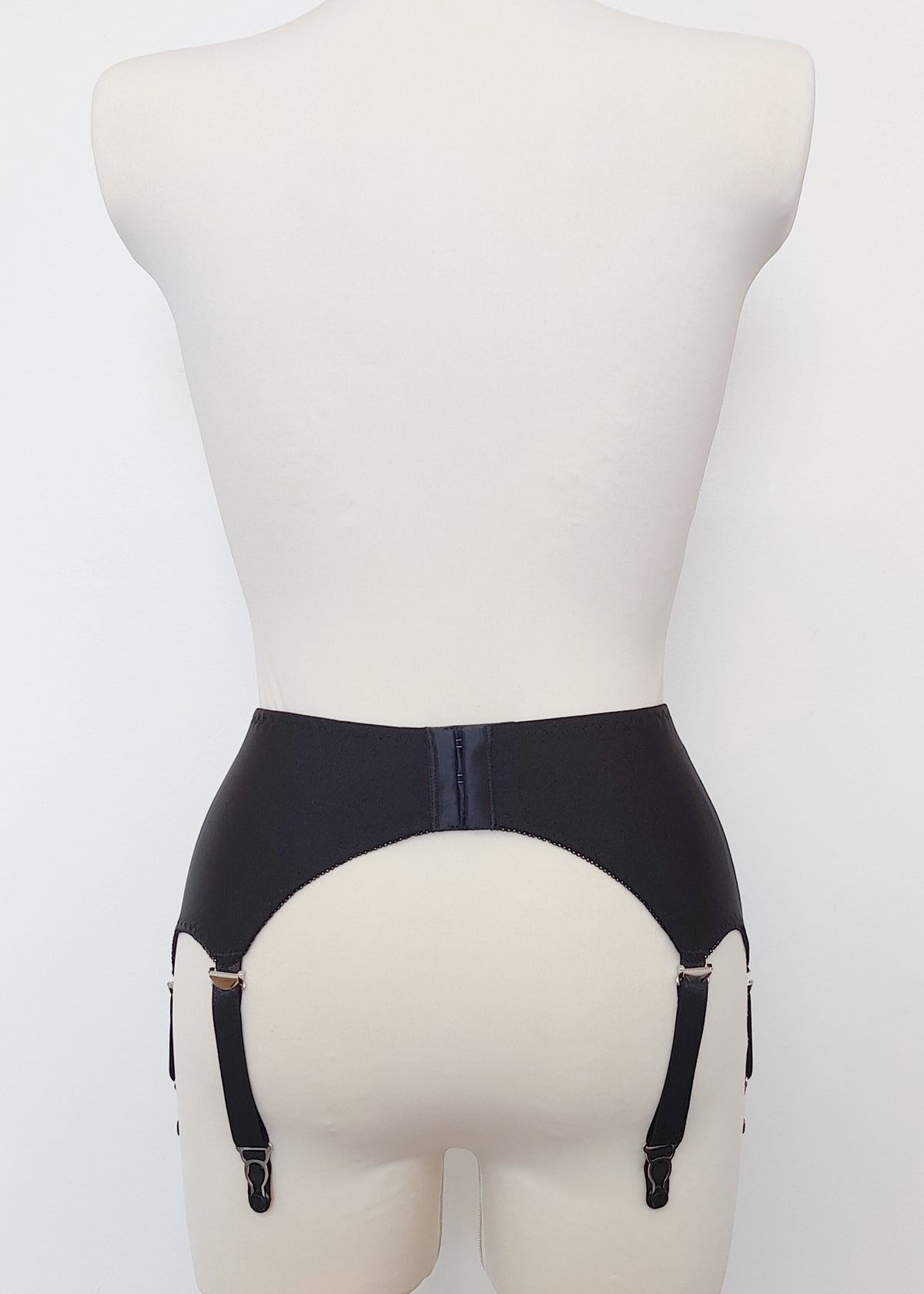 black, retro style, 6 strap Scarlett garter belt with black straps and lace side inserts, back view